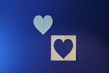 love is a white heart on a blue background