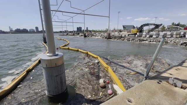 River boom at construction site trapping floating debris