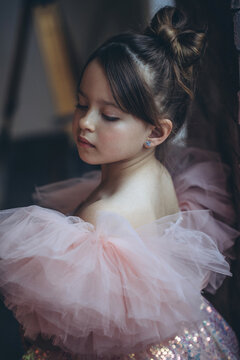 Little girl in a beautiful dress. Happy fashionable child. High quality photo