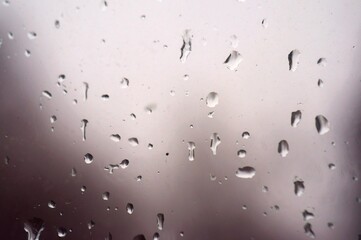 A wet glass window with raindrops. Background image.