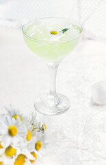 Refreshing chamomile drink. Very narrow focus, the center of the drink in focus.