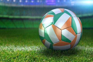 Fototapeta premium Ireland Soccer Ball on Stadium Green Grasses at Night