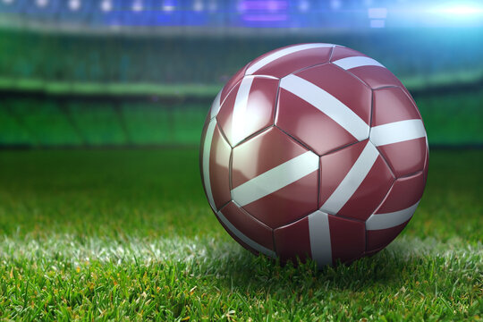 Latvia Soccer Ball on Stadium Green Grasses at Night