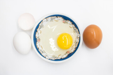 whole eggs and broken isolated on white background