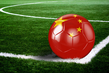 Fototapeta na wymiar China Soccer Ball on Field at Night