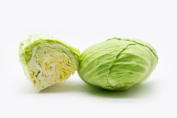 Whole and slices fresh green Cabbage isolated on white background..