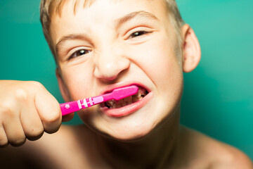 child brushing teeth in the bathroom