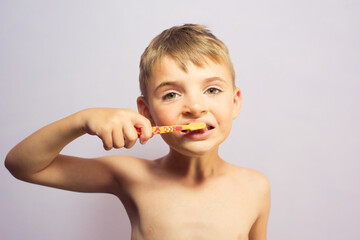 child brushing teeth in the bathroom