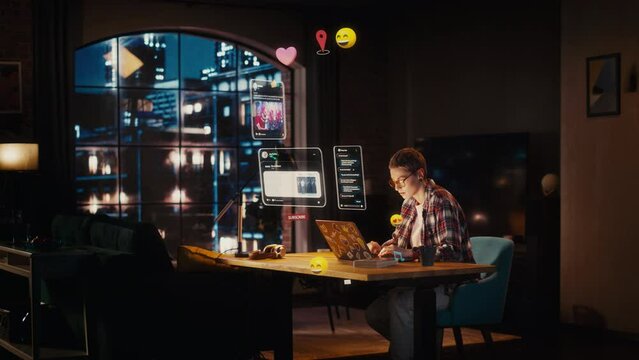 Beautiful Young Female Sitting at a Desk at Home, Working on Laptop in Living Room. Internet of Things Concept with Animated VFX of Different Social Media Posts and Emojis Popping Out of the Computer.