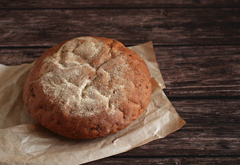 round buckwheat bread on a wooden background