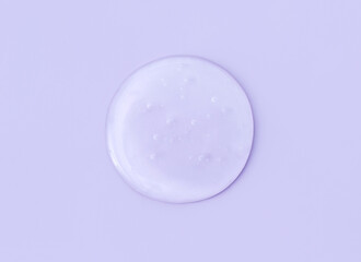 round drops of transparent gel serum on a  pastel  background	
