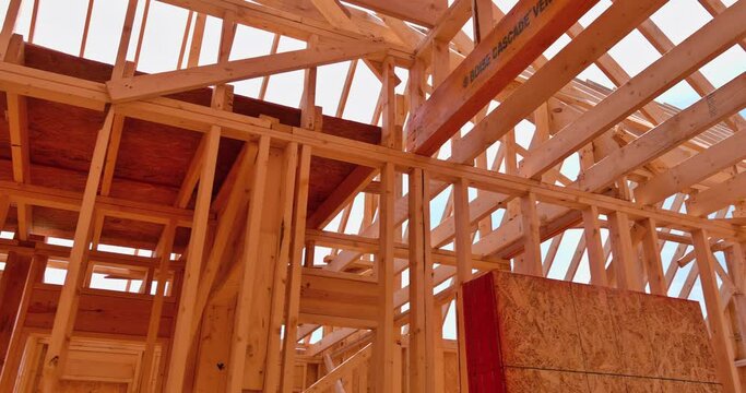 Wood framing beams stick framework of a built house under construction