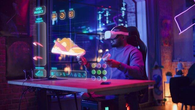 Black Shoes Designer Wearing Virtual Reality Headset and Using Controllers to Design a Stylish Fashionable Sneaker in Augmented Design Software. Creative Man Working on Custom Digital Shoe at Home.