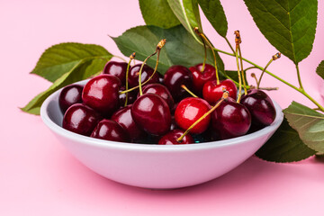 Juice and fresh cherry with leaf and water drops on blue background. Sweet red berry cherries. Summer fruit Background