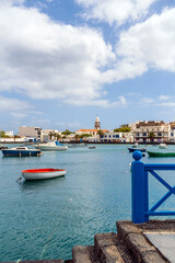 Arrecife quay with historic architecture and boats on blue water, Lanzarote, Canary Islands, Spain