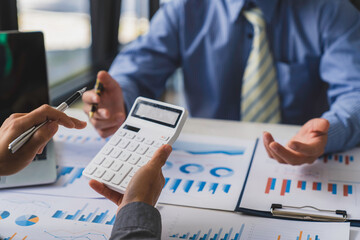 Bookkeeper accountant or financial expert, male economist accounting money with statistics graphs pointing on the accounts for investment results and income Company expenditure