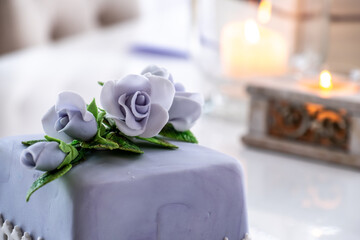Beautiful decorated fruit cake with blue roses