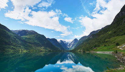 Plakat Majestic beautiful fjord landscape in Norway Fjord lake mountain snow water reflection glacial valley