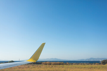 View from the airplane window to the sea during takeoff.