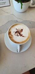 Obraz na płótnie Canvas decorated coffee cup top view