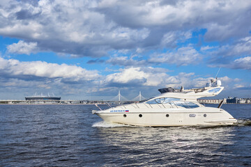 Fototapeta na wymiar Luxury private motor yacht sailing in the bay