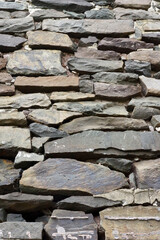 Rustic wall of horizontal fieldstone