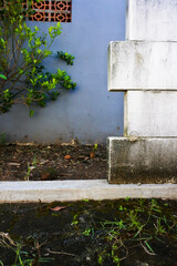 incompletely arranged white light bricks in a garden