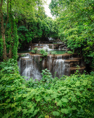 Fototapeta na wymiar beautiful emerald waterfalls green forest mountains guiding for backpacker Thailand destinations backpacking camping relaxing hiking at Huai Mae Khamin waterfall national park, Kanchanaburi.