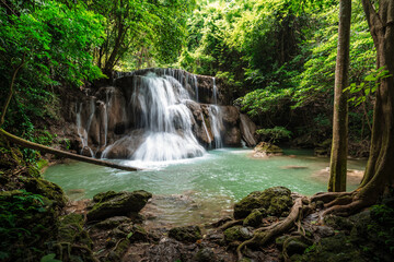 Fototapeta na wymiar beautiful emerald waterfalls green forest mountains guiding for backpacker Thailand destinations backpacking camping relaxing hiking at Huai Mae Khamin waterfall national park, Kanchanaburi.