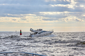 Naklejka premium Luxury private motor yacht sailing in the bay