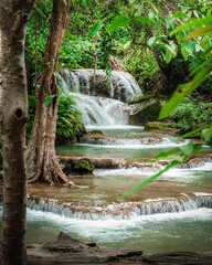 Obraz premium beautiful emerald waterfalls green forest mountains guiding for backpacker Thailand destinations backpacking camping relaxing hiking at Huai Mae Khamin waterfall national park, Kanchanaburi.