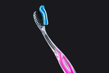 toothbrush with toothpaste for cleaning teeth on a dark background. health care. health items