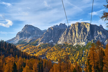 Ski lifts along the ski slope near the Cinque Torri mountains the background Tofane mountain near the famous town of Cortina d'Ampezzo in Italy © Ryzhkov Oleksandr