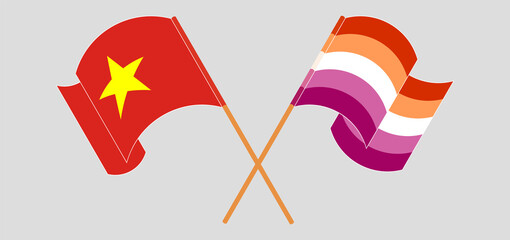 Crossed and waving flags of Vietnam and Lesbian Pride