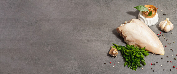 Raw chicken breast with spices and fresh parsley. Farm product, BIO poultry. Healthy food concept