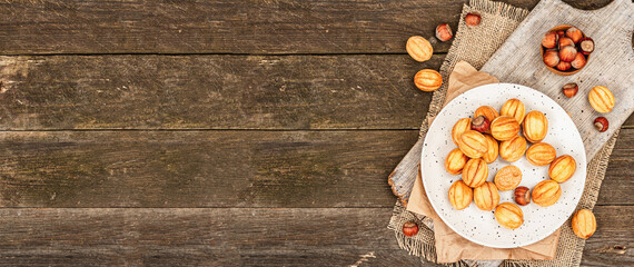 Cookies in the shape of walnuts with condensed milk cream filling.Delicious shortbread sandwiches