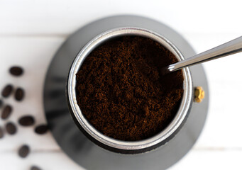 Fresh fragrant ground coffee in a geyser coffee maker. Brewing natural coffee in a geyser coffee maker. Top view. Selective focus.