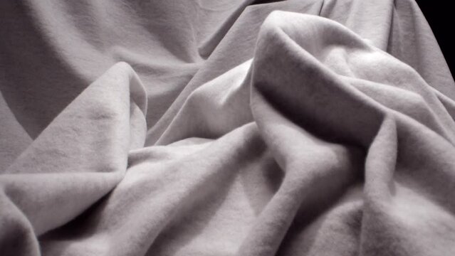Push In on a Grey Blanket Thrown Carelessly  on a Chair, Artistic Shot