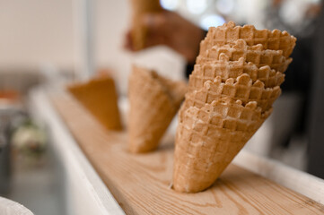 empty waffle cups in a restaurant before serving ice cream.