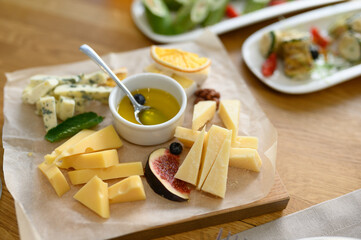 Cheese plate gorgonzola parmesan brie or camembert and maasdam with honey