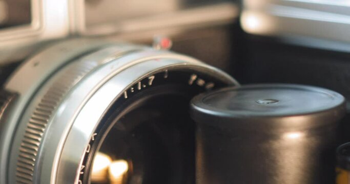 Macro Dolly of Vintage and Antique 35mm Cameras and Equipment with close up on rangefinder camera