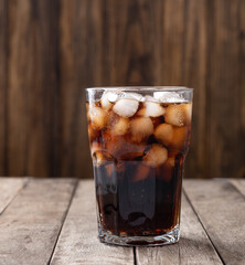 Cola soda, soft drink in cup with ice