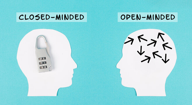 Silhouette of two people, one man is closed minded with a lock in his head, opposite to the person with the open minded brain, different mindset