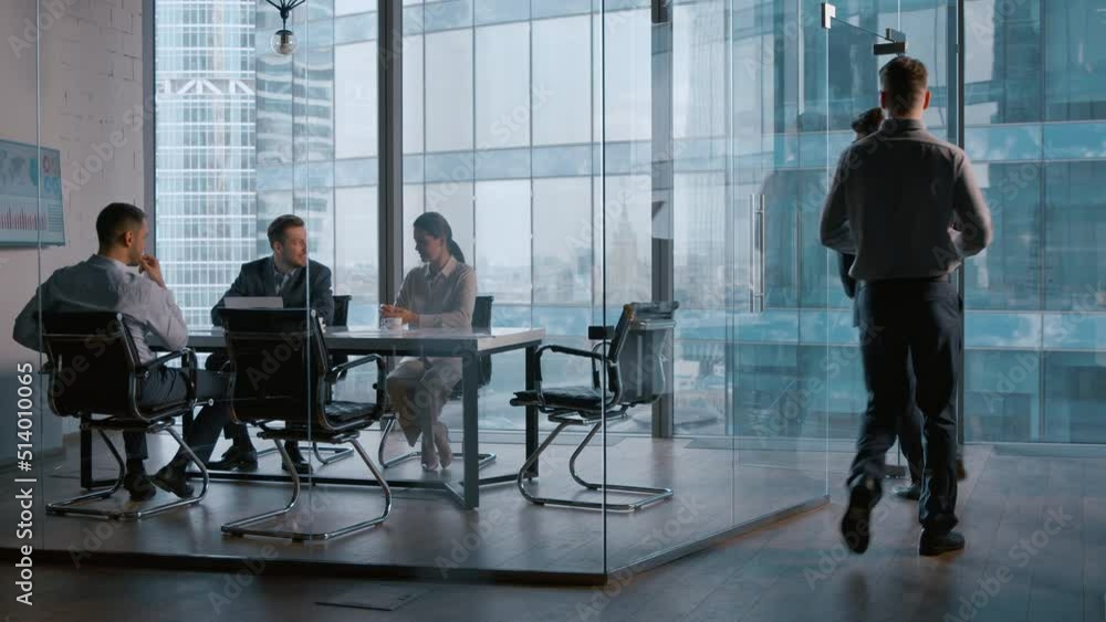 Poster Handshake in the office: young business partners at a meeting