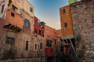 Colorful historical old town buildings in Guanajuato state, Mexico. Vivid, multicolored colonial neighborhood streets with traditional Mexican architecture.