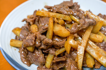 A delicious home-cooked dish, fried beef with potatoes