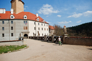 Fototapeta na wymiar Boy walking in Veveri castle, Czech Republic.