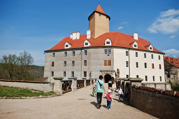 Family walking in Veveri castle, Czech Republic.