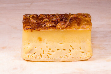 Thai sweetmeat.Khanom Mo Kaeng.Khanom Mo Kaeng on a wooden plate