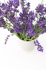 Beautiful summer lavender flowers in a vase close up, part of a home interior